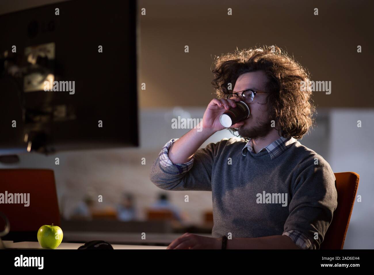 Tired Businessman working late Stock Photo