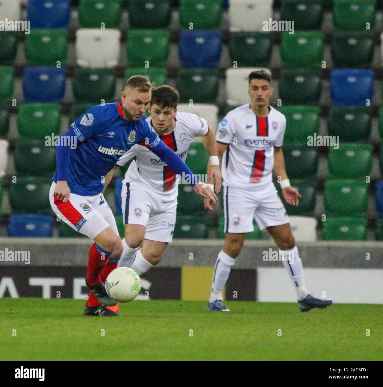 Windsor Park, Belfast, Northern Ireland. 03rd Dec 2019. BetMcLean League Cup - semi-final. Linfield (blue) v Coleraine.Action from tonight's game. Andy Mitchell (27) on the ball for Linfield. Credit: CAZIMB/Alamy Live News. Stock Photo