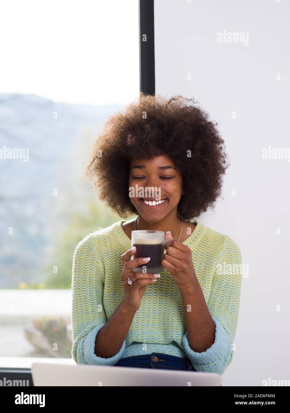 black woman in the living room on the floor Stock Photo - Alamy