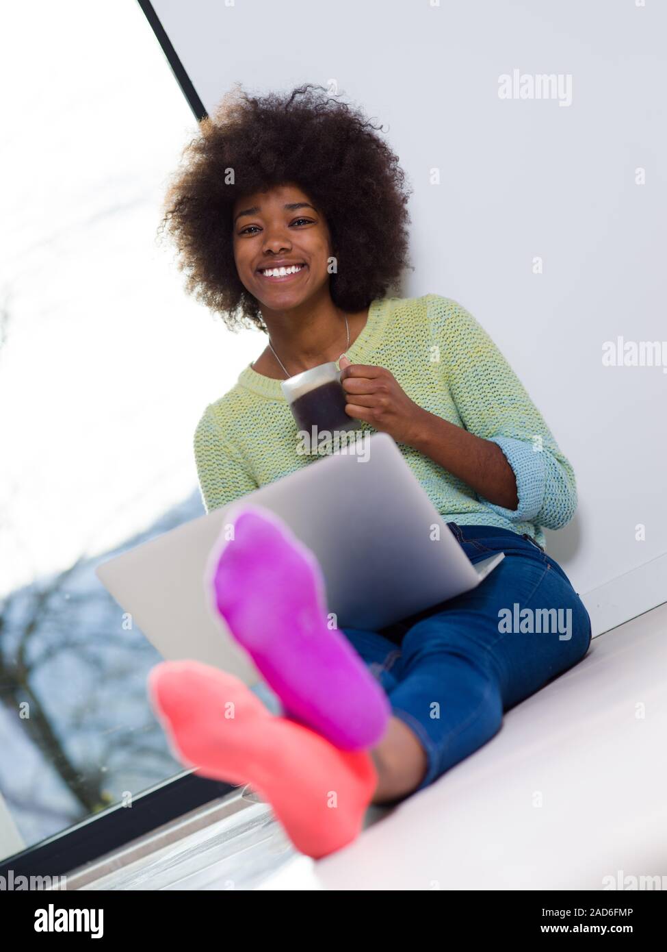black woman in the living room on the floor Stock Photo - Alamy