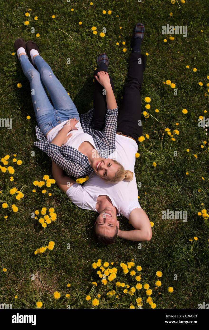 man and woman lying on the grass Stock Photo - Alamy