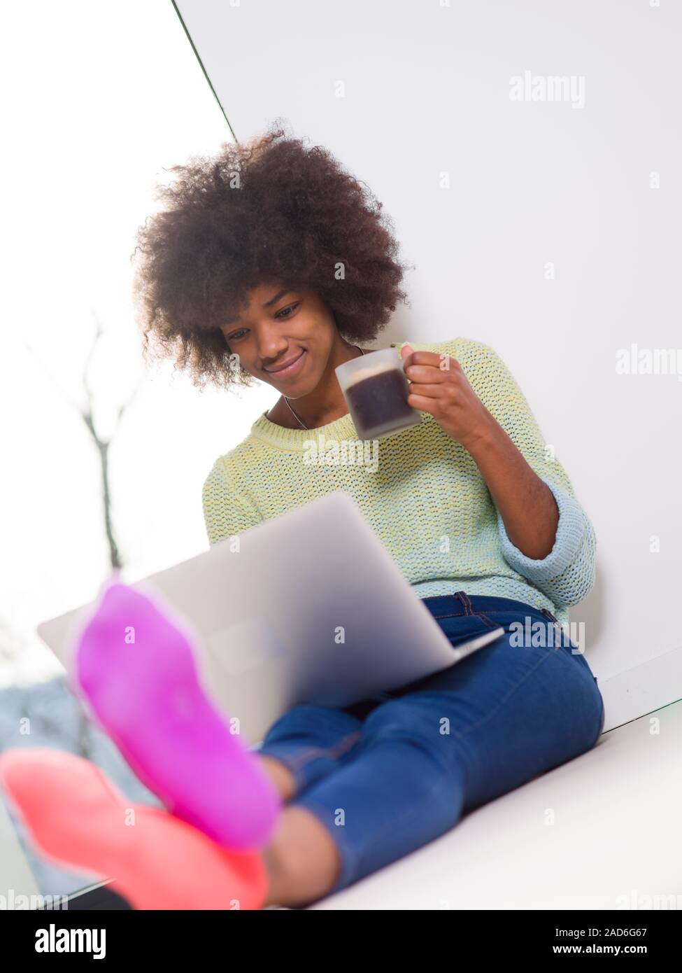 black woman in the living room on the floor Stock Photo - Alamy