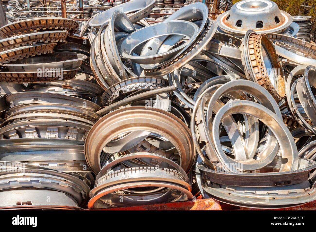 chrome wheel trims and hub caps in a junk yard in the desert in Phoenix