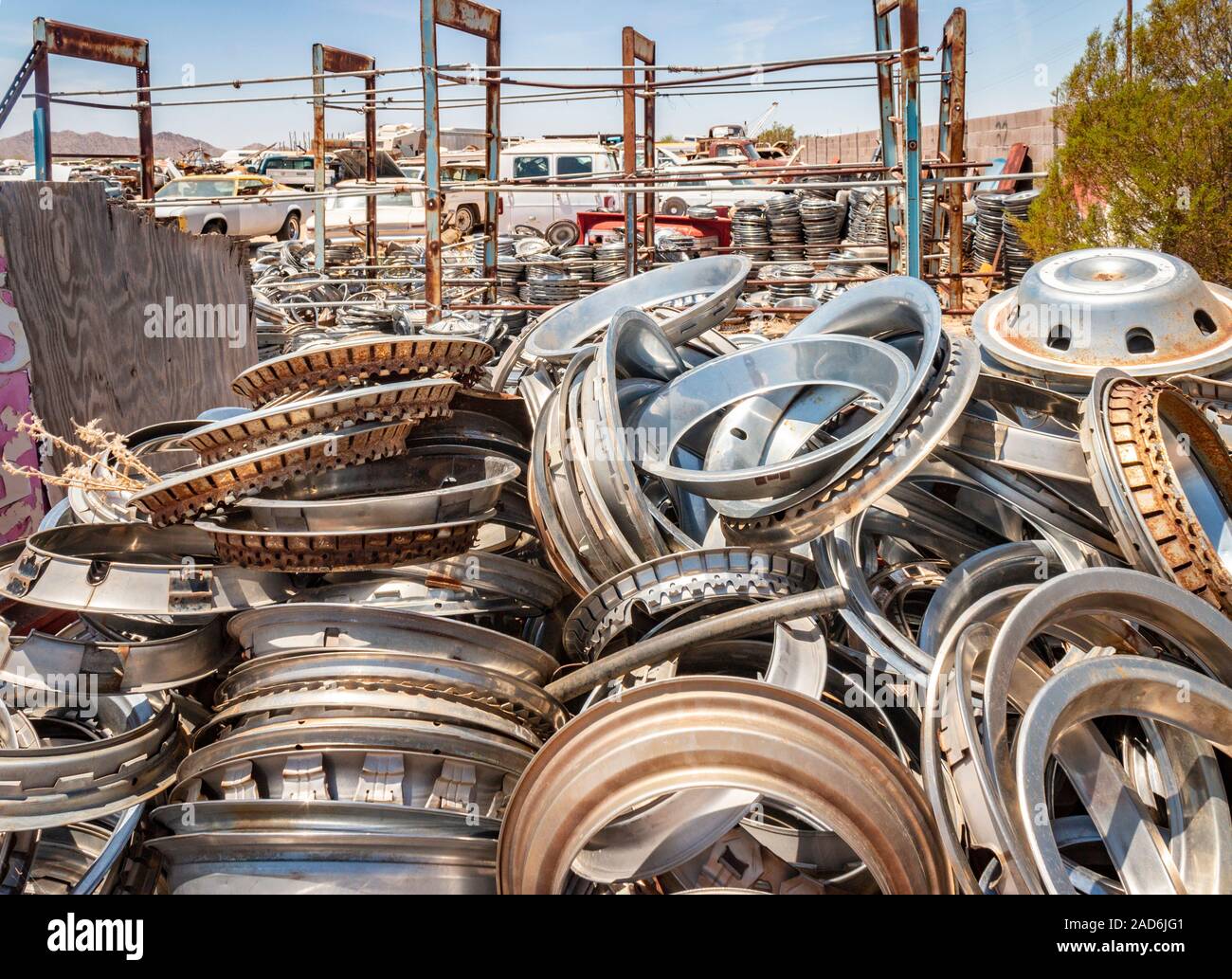 chrome wheel trims and hub caps in a junk yard in the desert in Phoenix