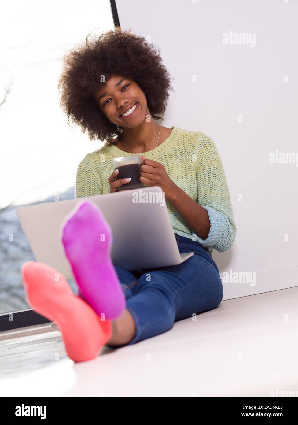 black woman in the living room on the floor Stock Photo - Alamy