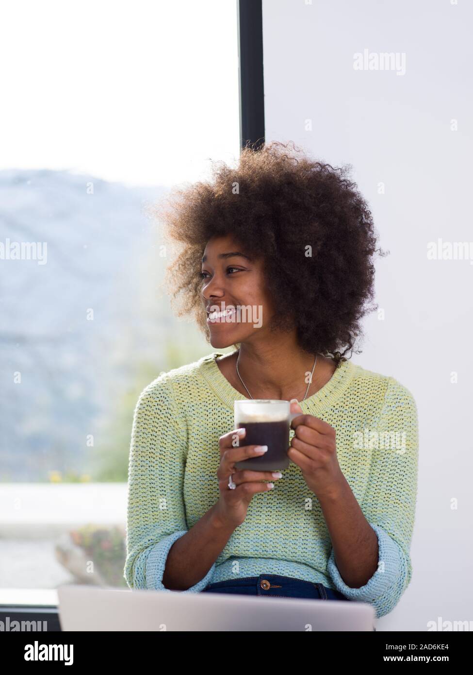 black woman in the living room on the floor Stock Photo - Alamy