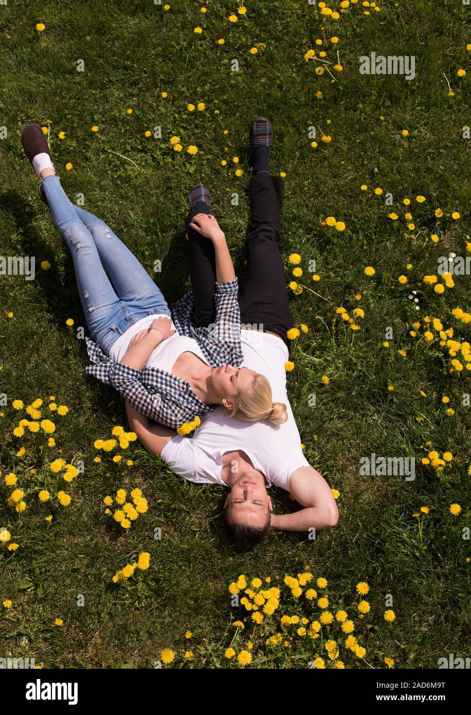 man and woman lying on the grass Stock Photo - Alamy
