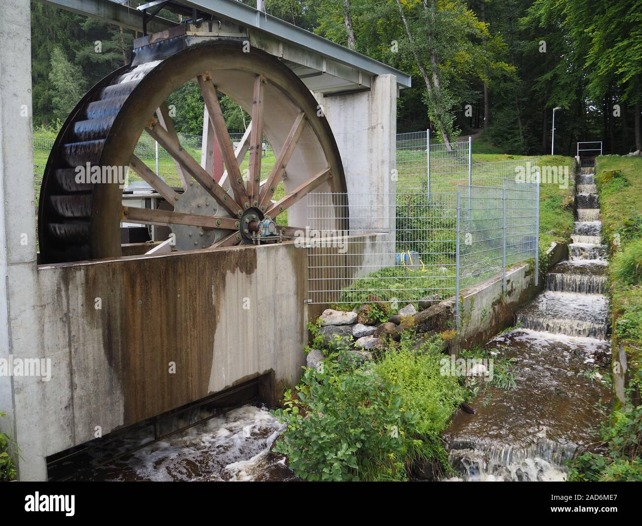 Water wheel to generate electricity Stock Photo Alamy