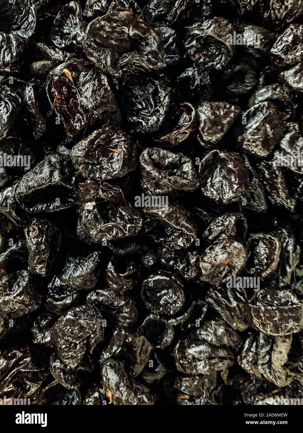 lots of sweet dried fruit prunes for eating a background Stock Photo