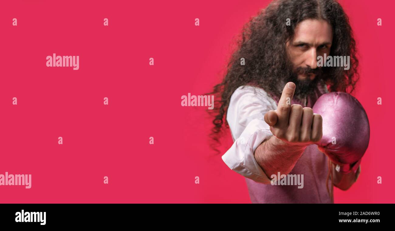 Skinny nerd challenging to a fight Stock Photo
