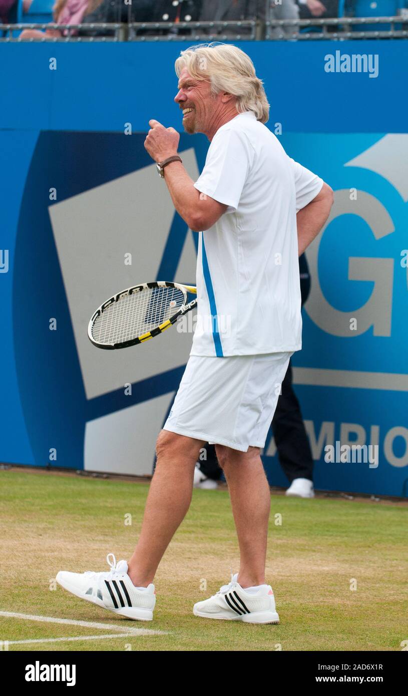 Sir Richard Branson appearing in a charity tennis tournament at Queen's tennis club in London with Andrew Murray, Michael McIntyre, Jimmy Carr, Jonathan Ross and Boris Johnson on behalf of the Ross Hutchins and Royal Marsden cancer charity in 2013. Stock Photo