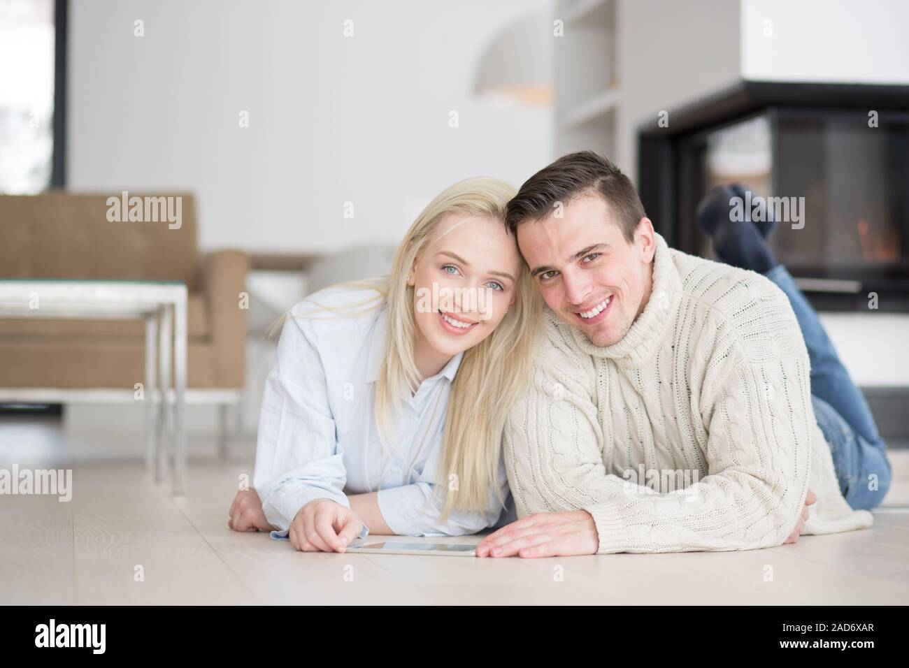 Young Couple using digital tablet on cold winter day Stock Photo