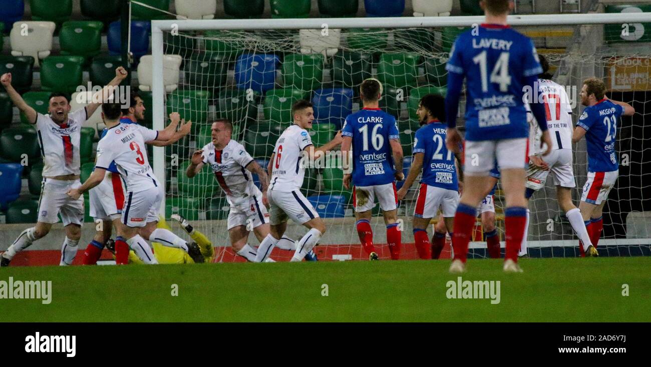 Windsor Park, Belfast, Northern Ireland. 03rd Dec 2019. BetMcLean League Cup - semi-final. Linfield (blue) v Coleraine.Action from tonight's game. Aaron Canning (4) celebrates his goal for Coleraine. Credit: CAZIMB/Alamy Live News. Stock Photo