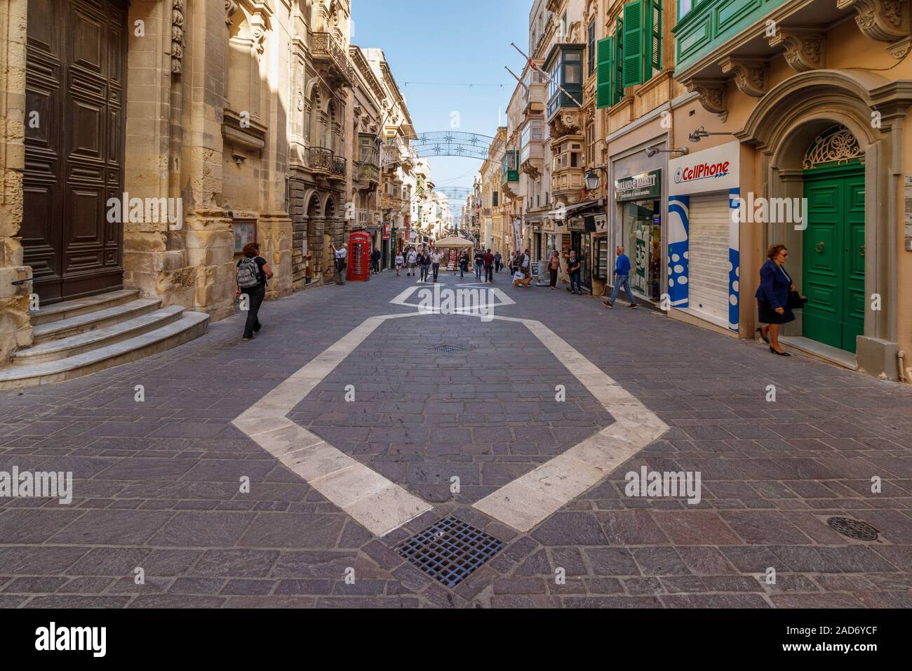 Merchants Street in Valletta, Malta. One of the main shopping streets in the city. Stock Photo