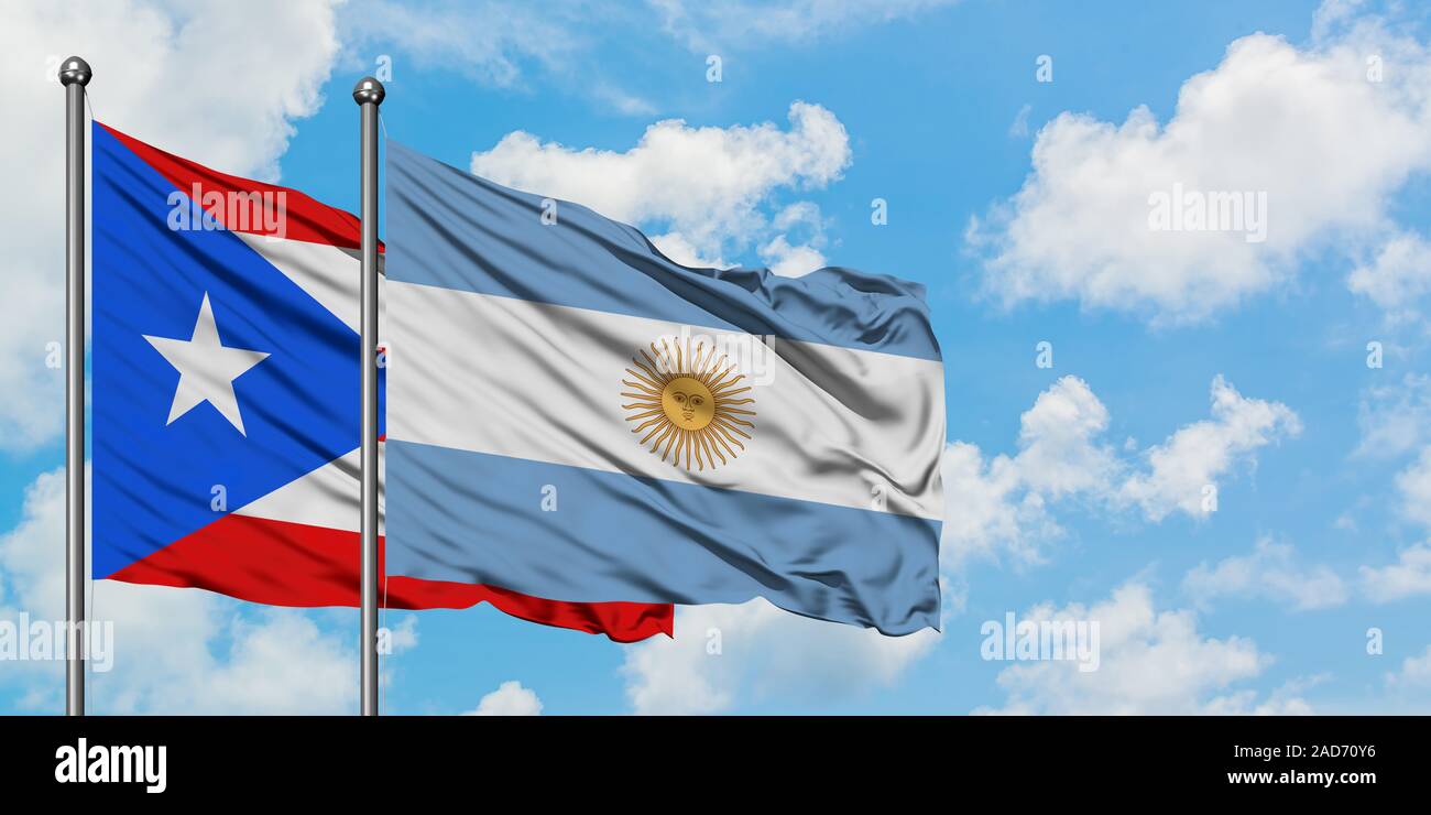 Puerto Rico and Argentina flag waving in the wind against white cloudy blue  sky together. Diplomacy concept, international relations Stock Photo - Alamy