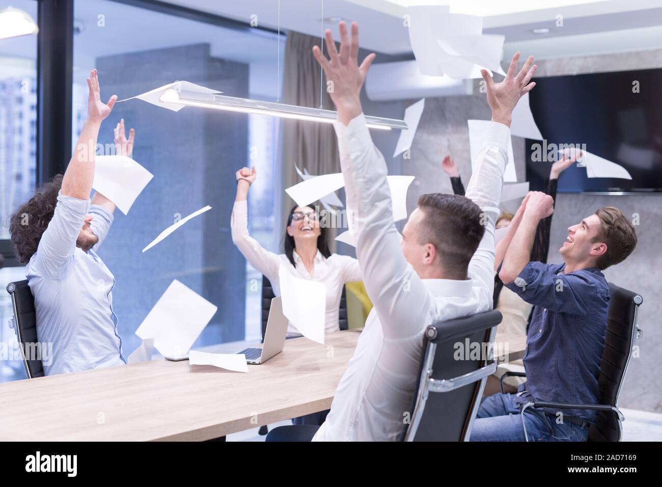startup Group of young Business people throwing documents Stock Photo ...