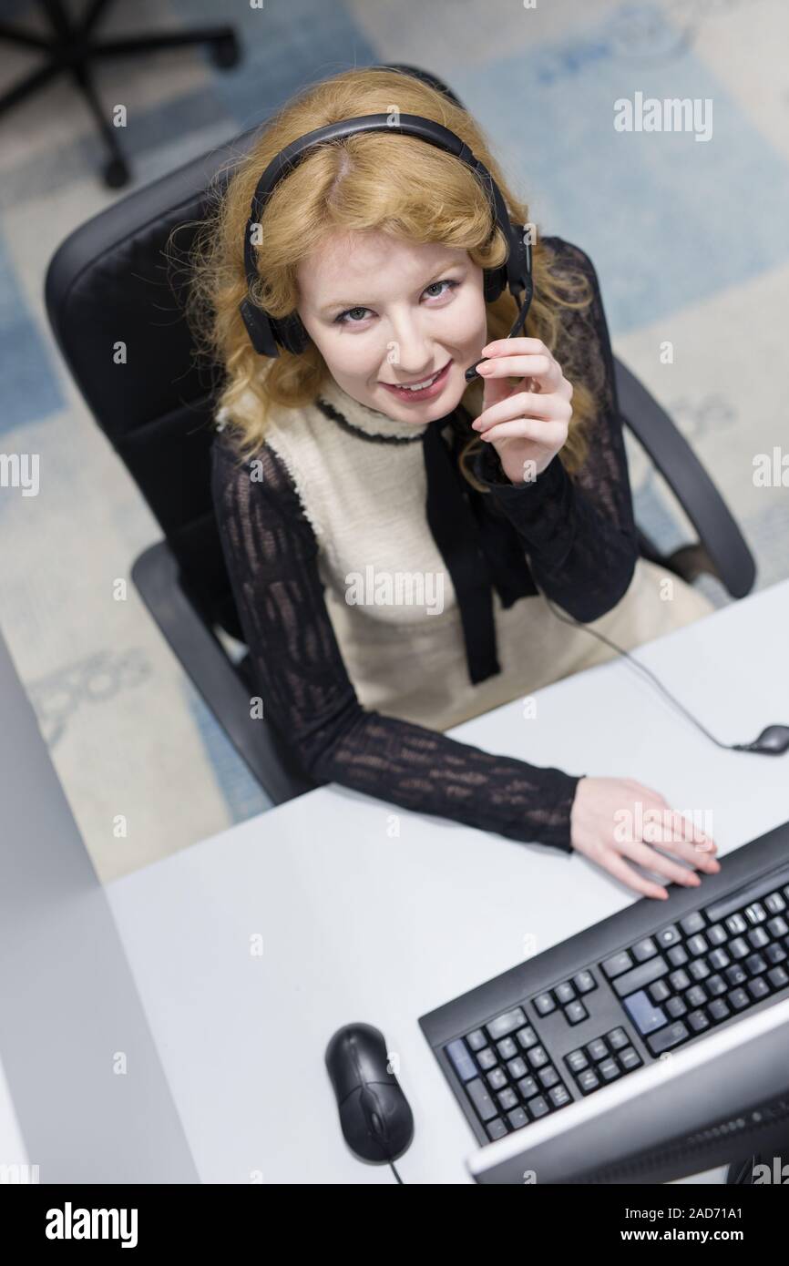 female call centre operator doing her job top view Stock Photo