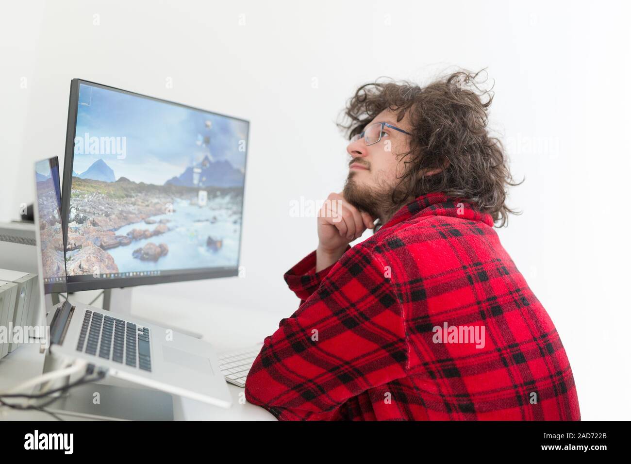 graphic designer in bathrobe working at home Stock Photo