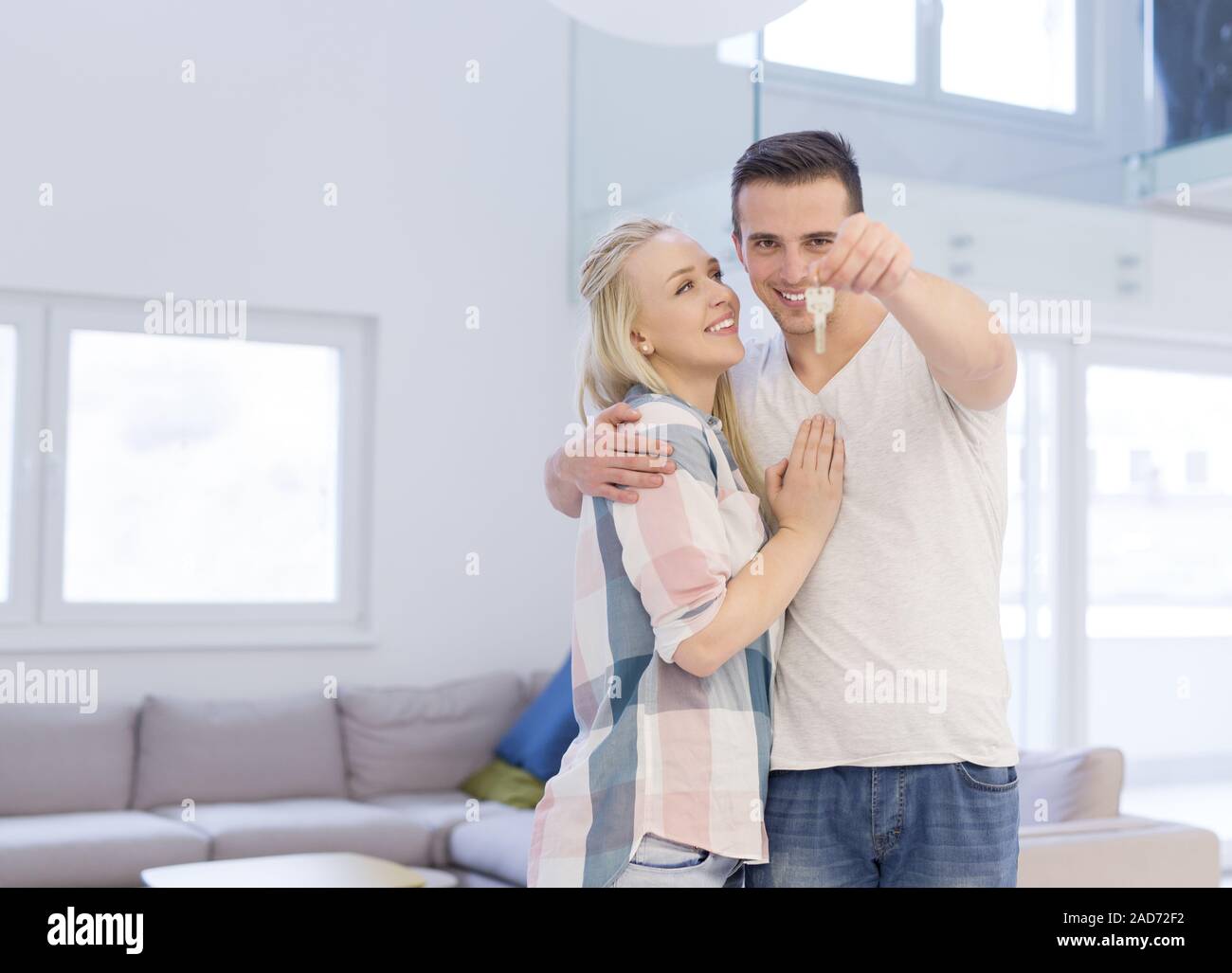 couple showing a keys of their new house Stock Photo - Alamy