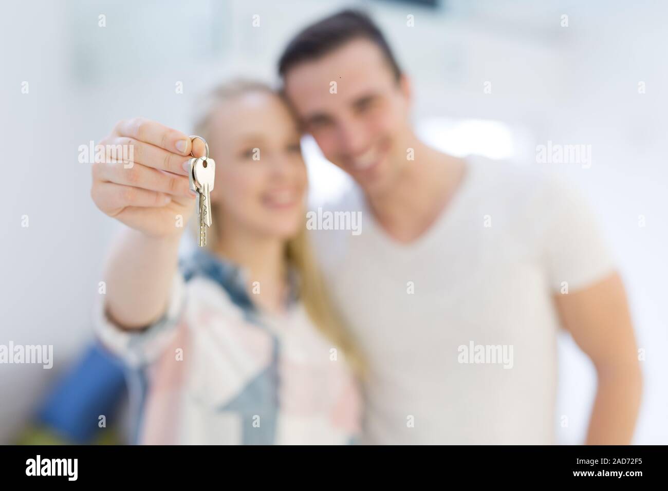 couple showing a keys of their new house Stock Photo - Alamy