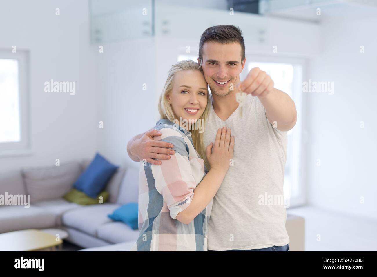 couple showing a keys of their new house Stock Photo - Alamy