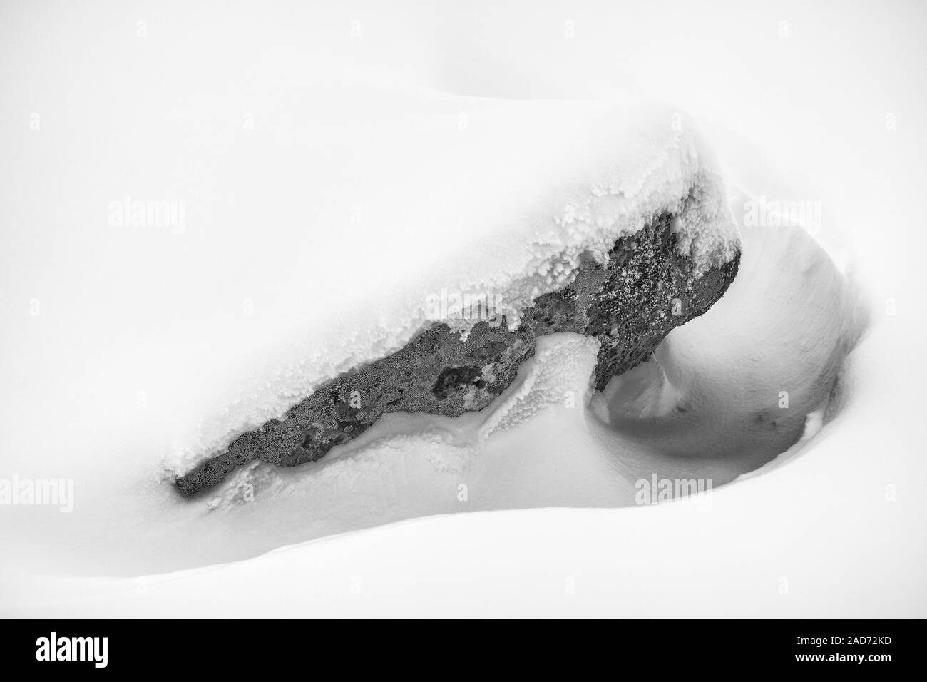 Snow covered rock, Lapland, Sweden Stock Photo