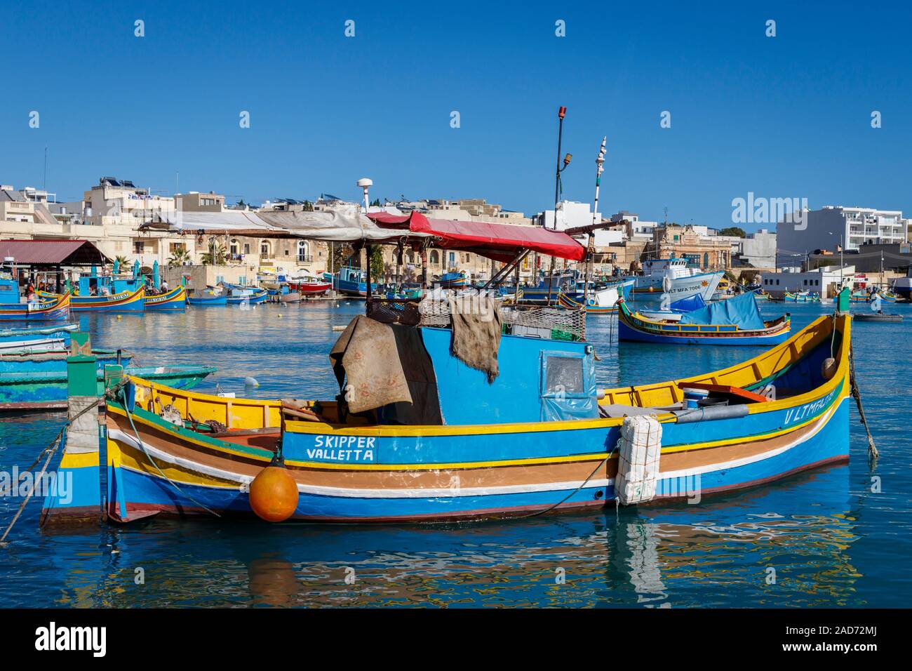 Marsaxlokk (Southern Port) fishing village in Malta , Europe. A popular tourist destination with a bay and fishing boats. Stock Photo