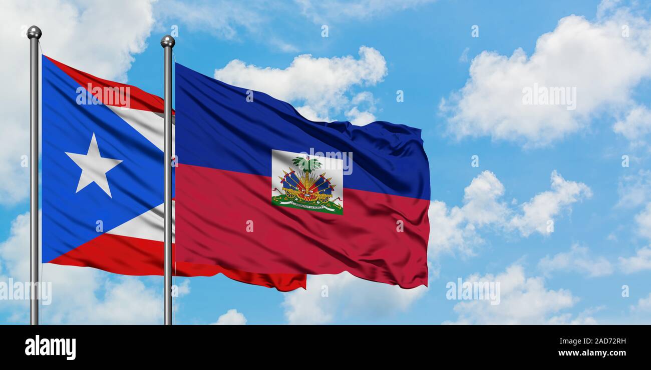 Puerto Rico and Haiti flag waving in the wind against white cloudy blue sky  together. Diplomacy concept, international relations Stock Photo - Alamy