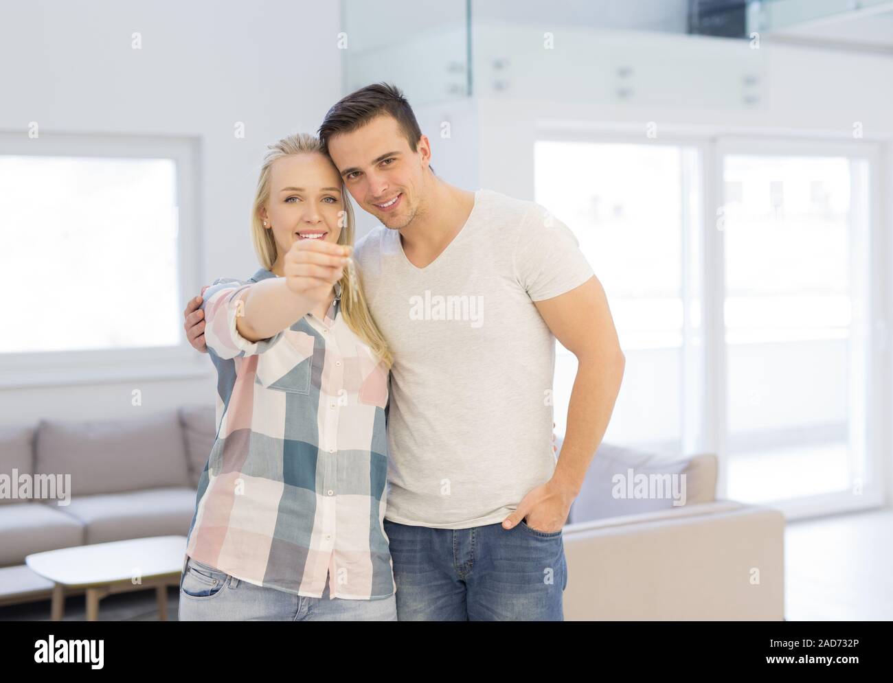 couple showing a keys of their new house Stock Photo - Alamy