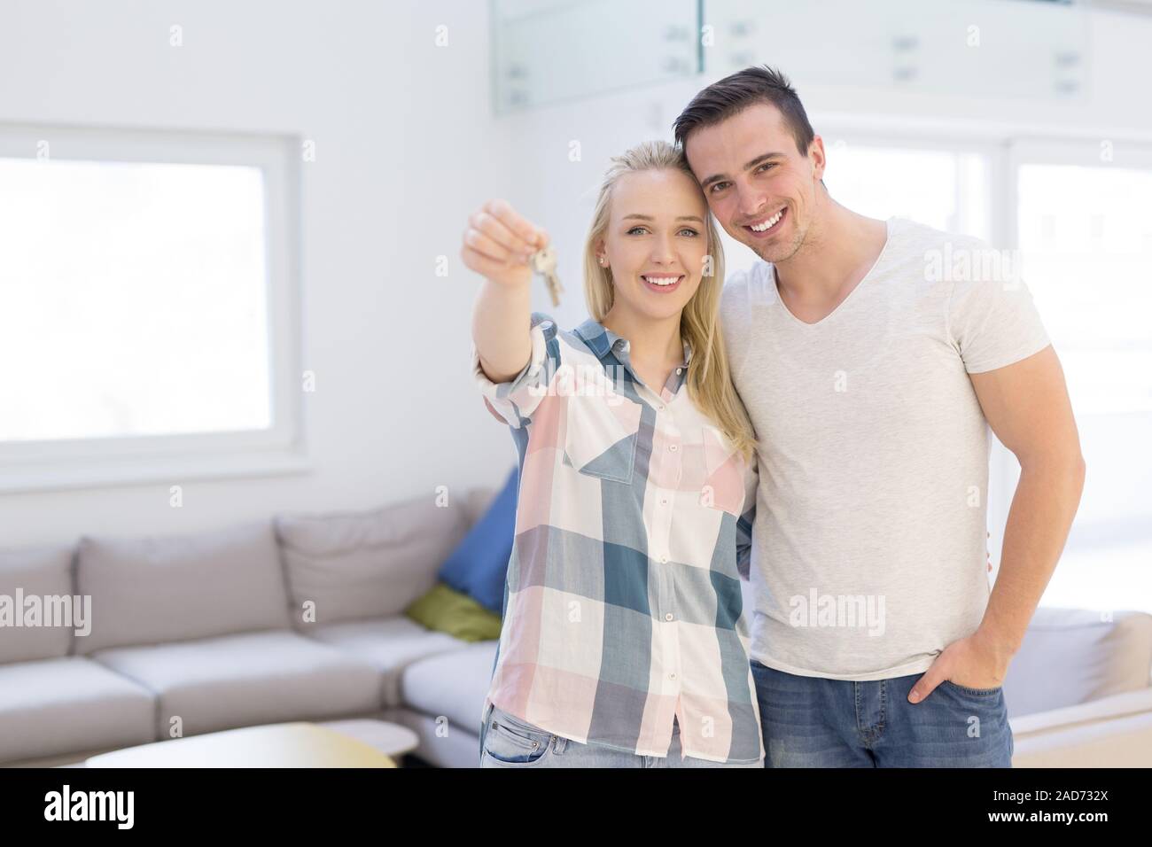 couple showing a keys of their new house Stock Photo - Alamy