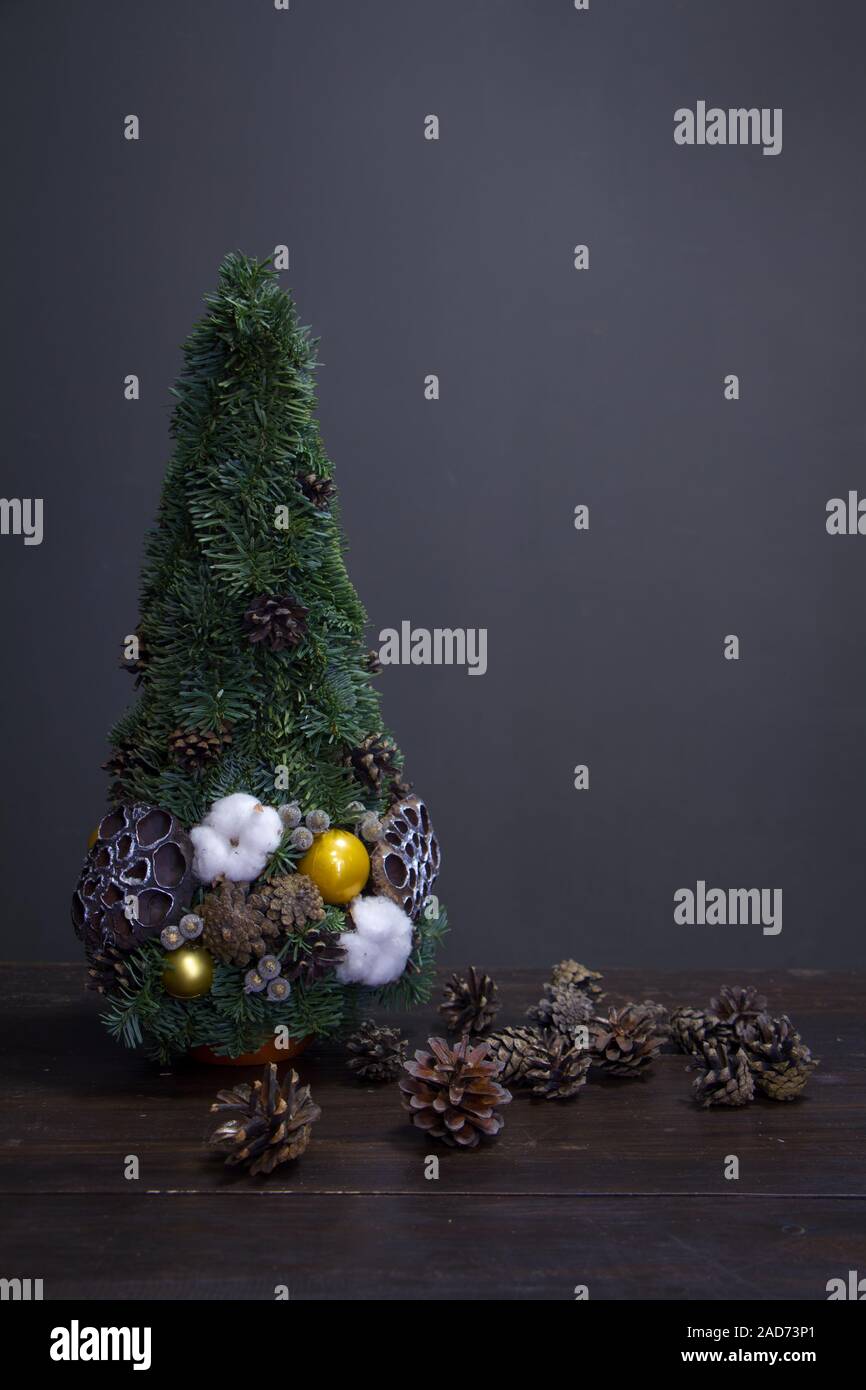 Christmas tree made of fir branches and decorated by natural materials ...