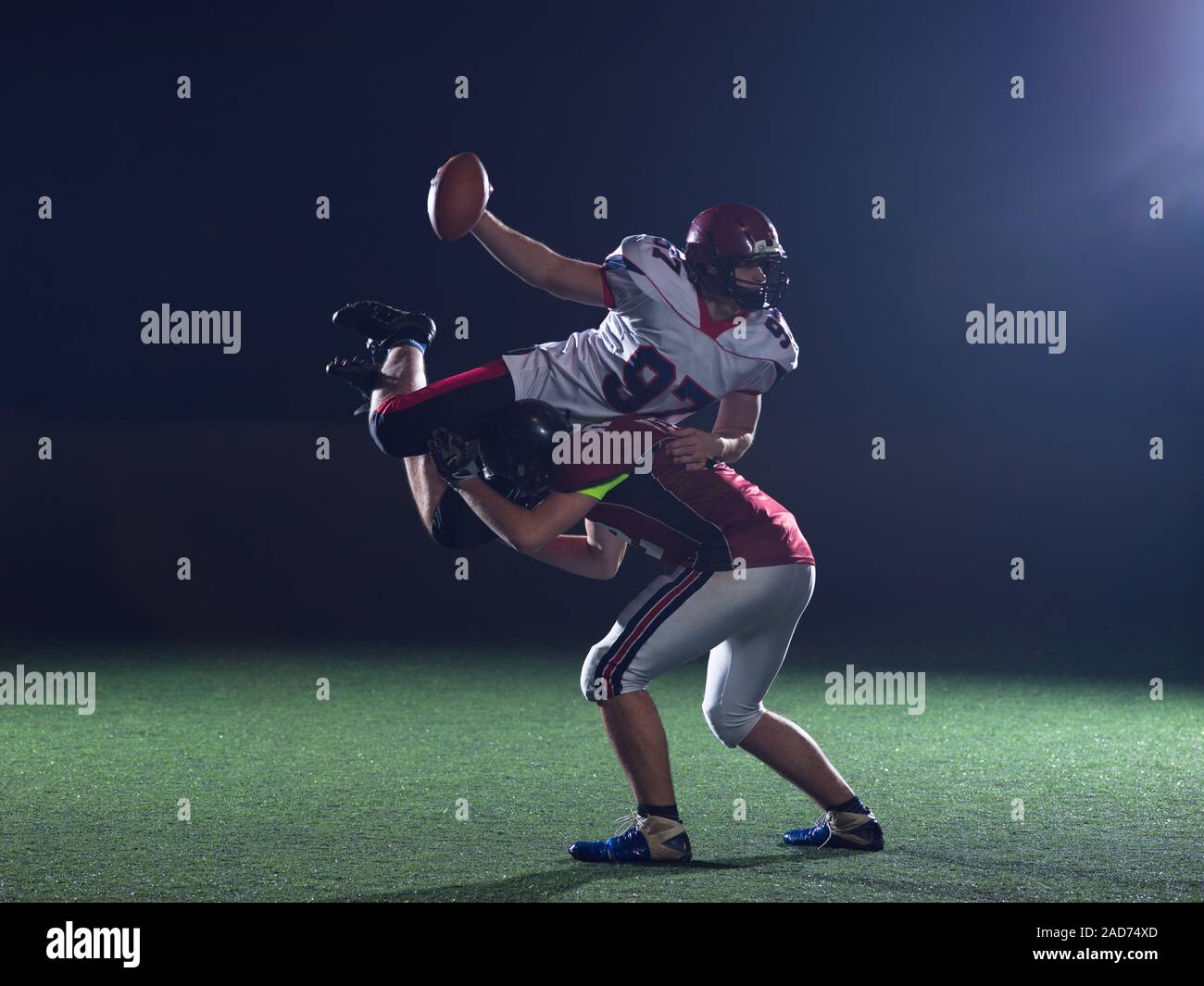 American football players in action Stock Photo - Alamy