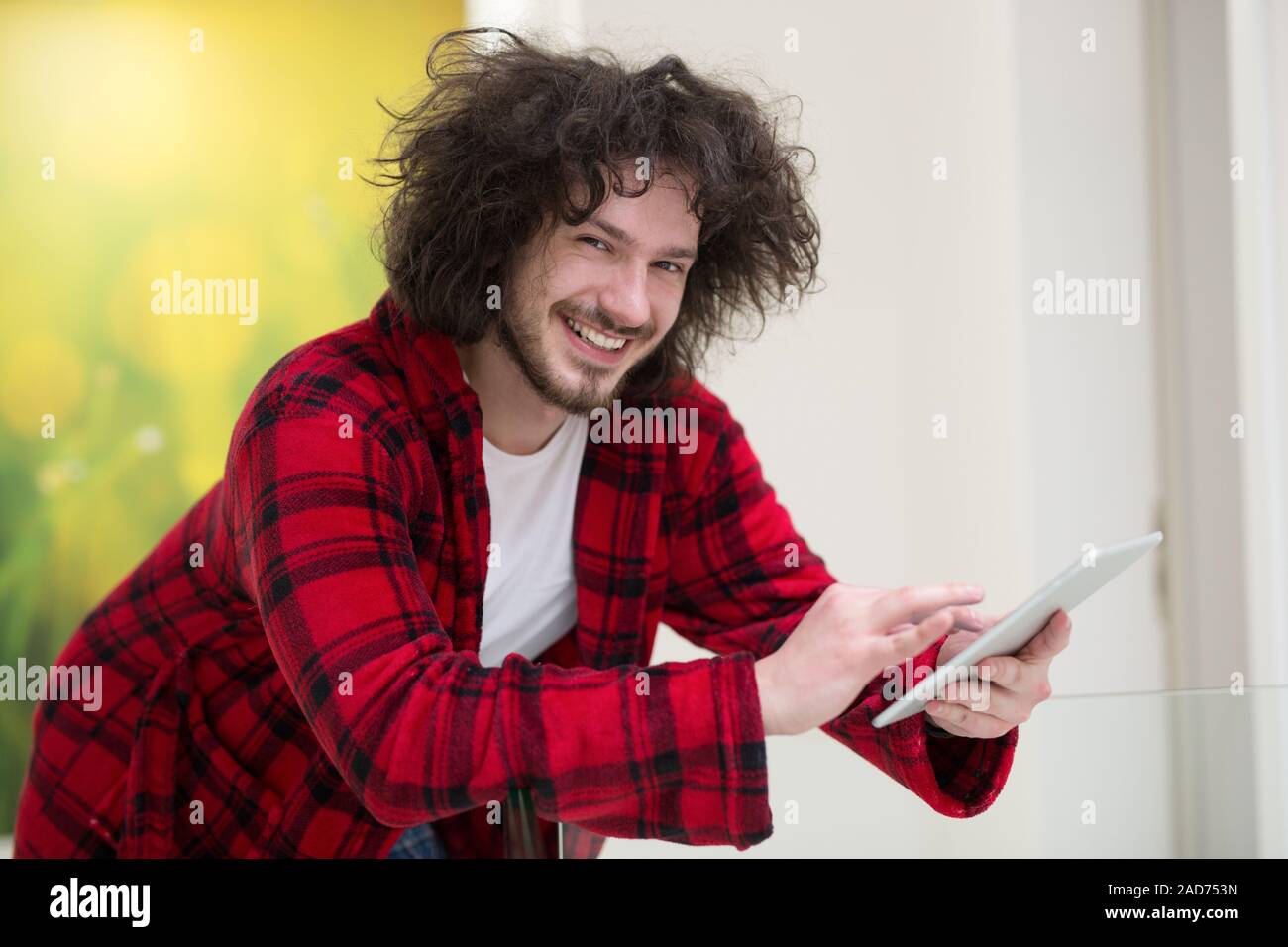young freelancer using tablet computer Stock Photo