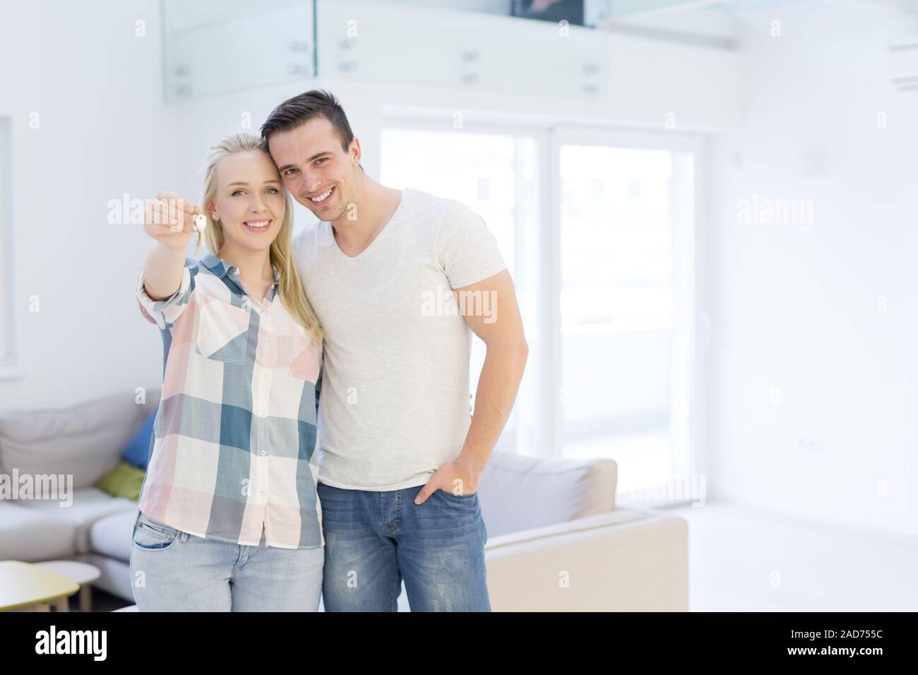 couple showing a keys of their new house Stock Photo - Alamy