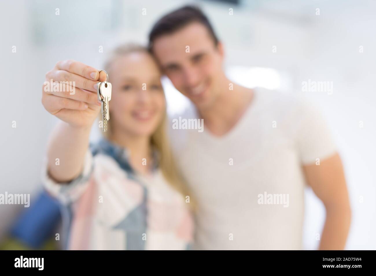 couple showing a keys of their new house Stock Photo - Alamy