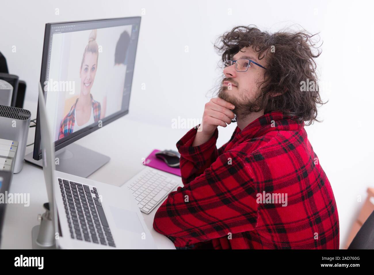 graphic designer in bathrobe working at home Stock Photo