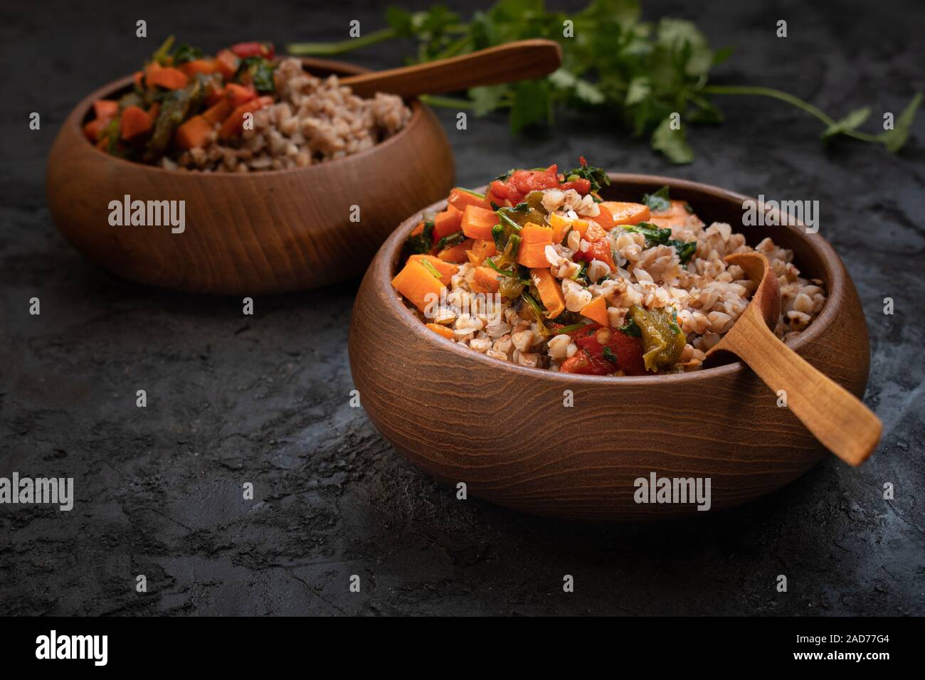 Vegan buckwheat groats cooked with carrot and roasted bellpepper served