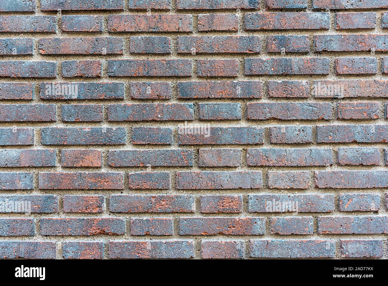 Background from a dark red brick wall Stock Photo