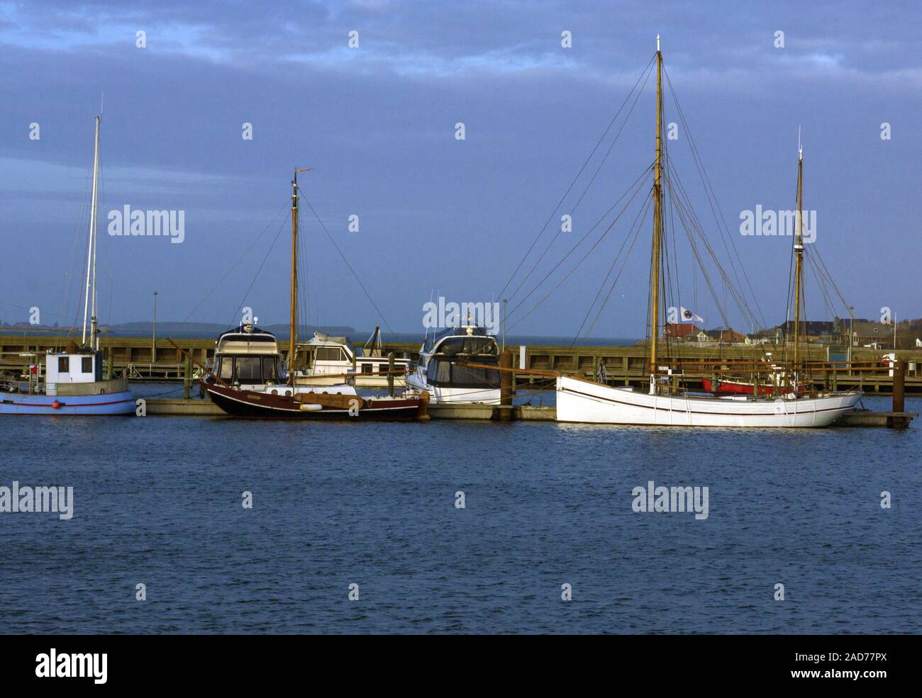 Sailing, fishing ships at bay Stock Photo