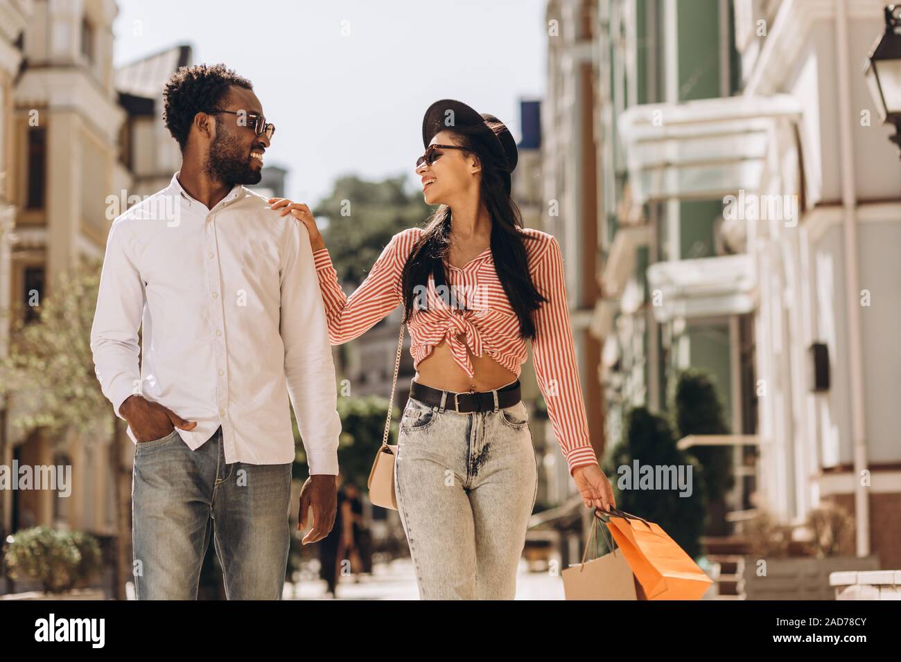 Delighted lady walking with boyfriend stock photo Stock Photo