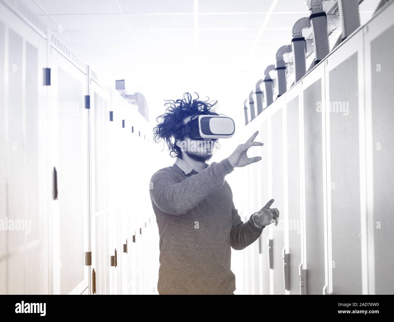 IT engeneer using virtual reality headset Stock Photo