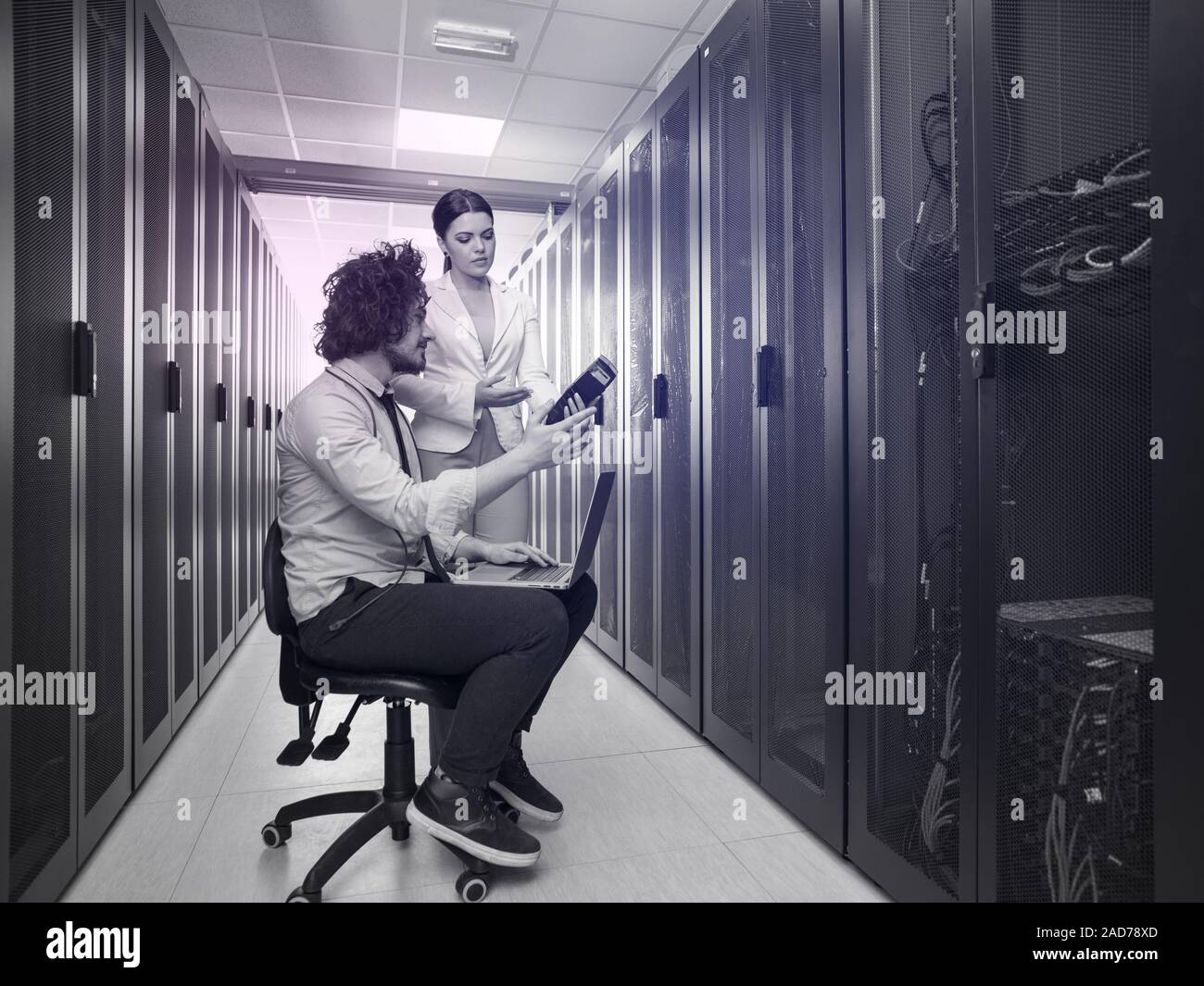 technicians working together on servers Stock Photo