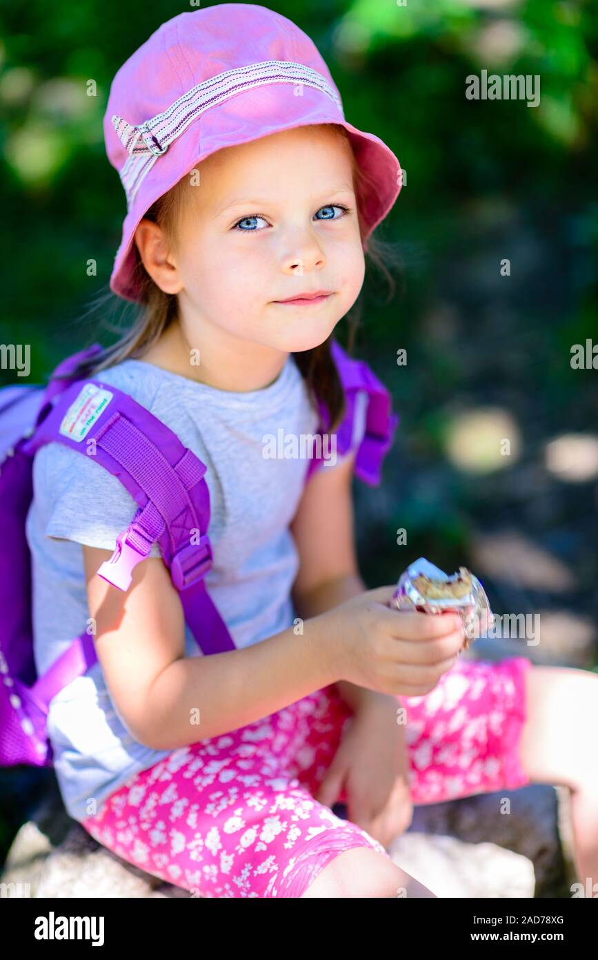 girl eating chocolate wafers - chocolate bar Stock Photo