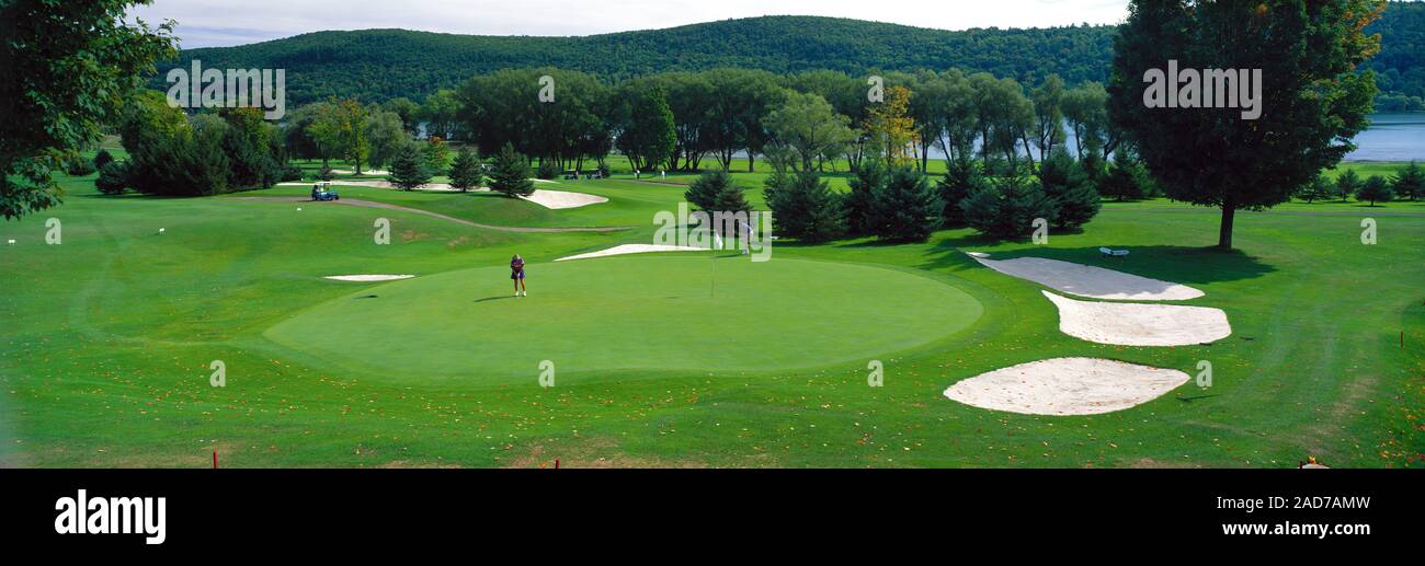 Golfer playing at Leatherstocking Golf Course, New York State, USA Stock Photo