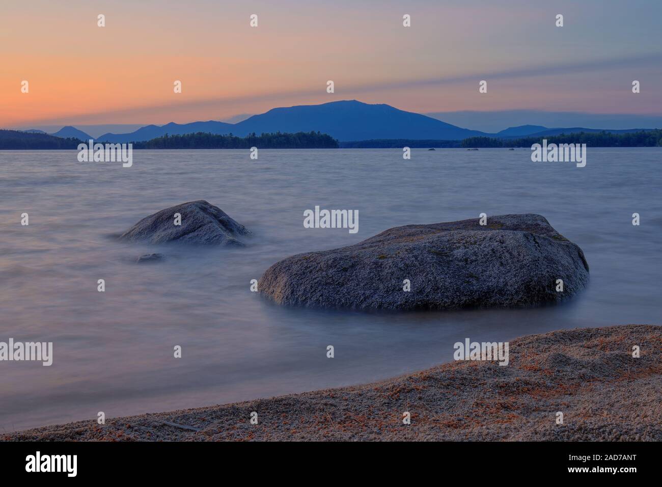 A long exposure shot of Ambajejus Lake with Katahdin in the back. Stock Photo