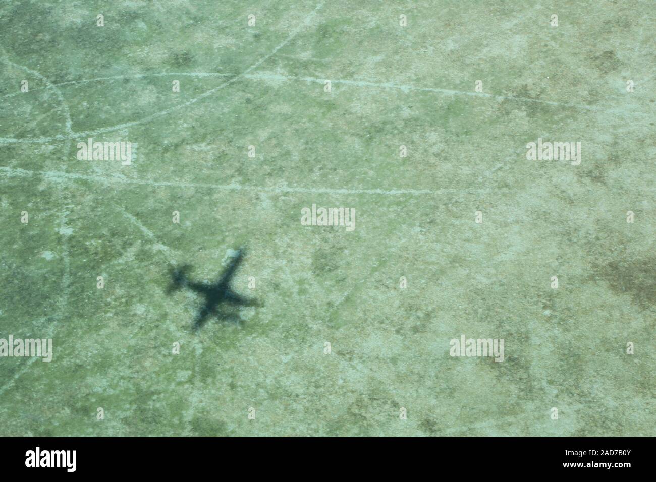 Abu Dhabi, shadow of a seaplane in the desert sand Stock Photo