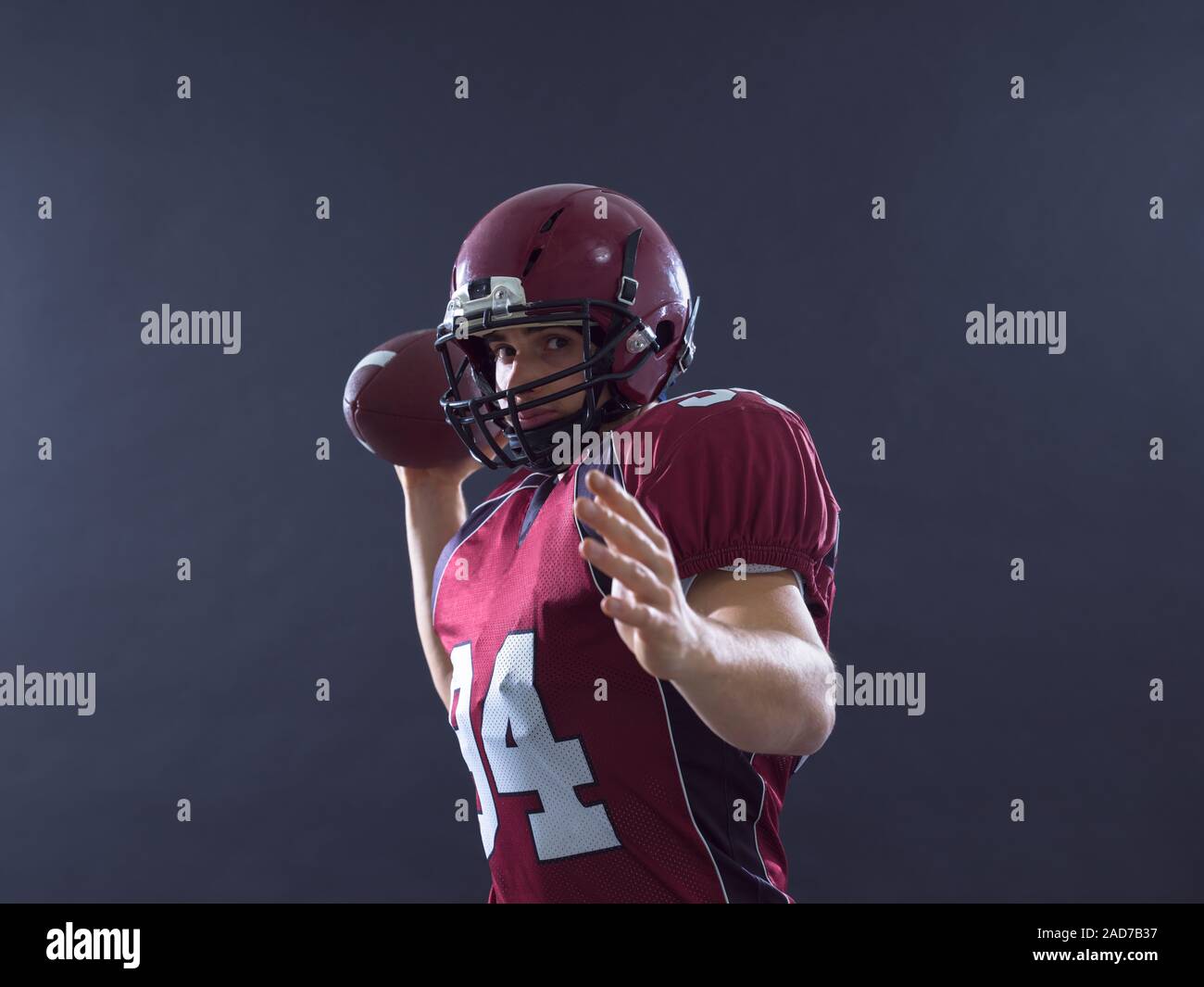 american football player throwing ball Stock Photo Alamy