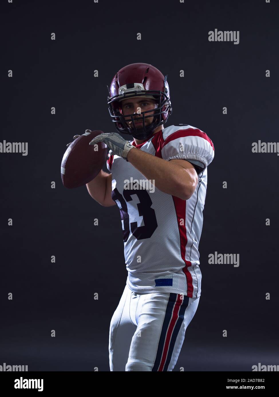 american football player throwing ball Stock Photo Alamy