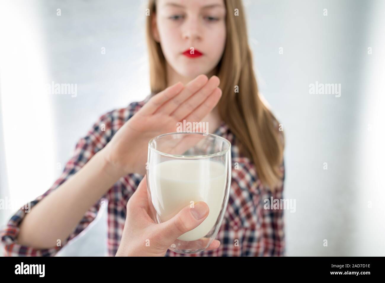 Lactose intolerance. Dairy Intolerant young girl refuses to drink milk