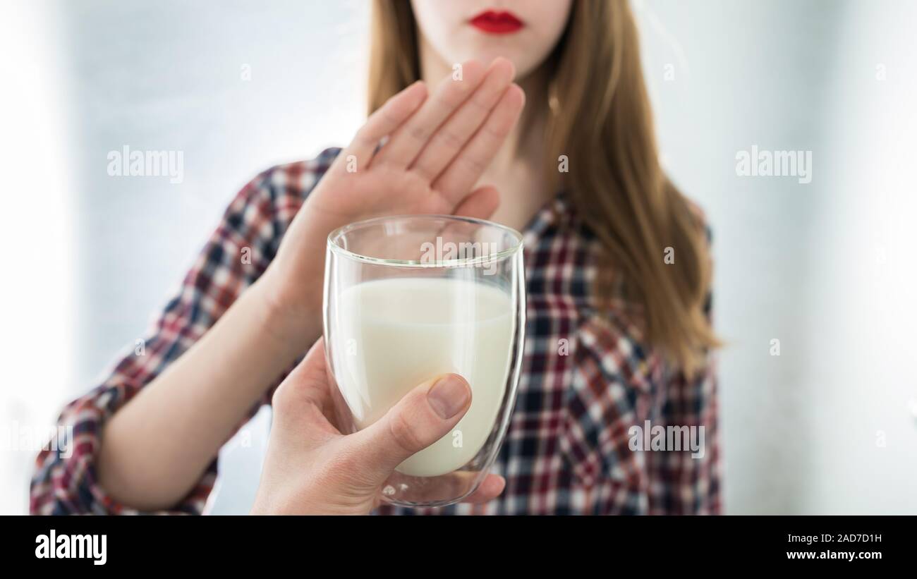 Lactose intolerance. Dairy Intolerant young girl refuses to drink milk